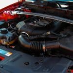 Motor Hills | Strut Bar vs. Sway Bar: Which Should You Choose? Close up of a Ford Mustang 5.0L engine with a sway bar installed