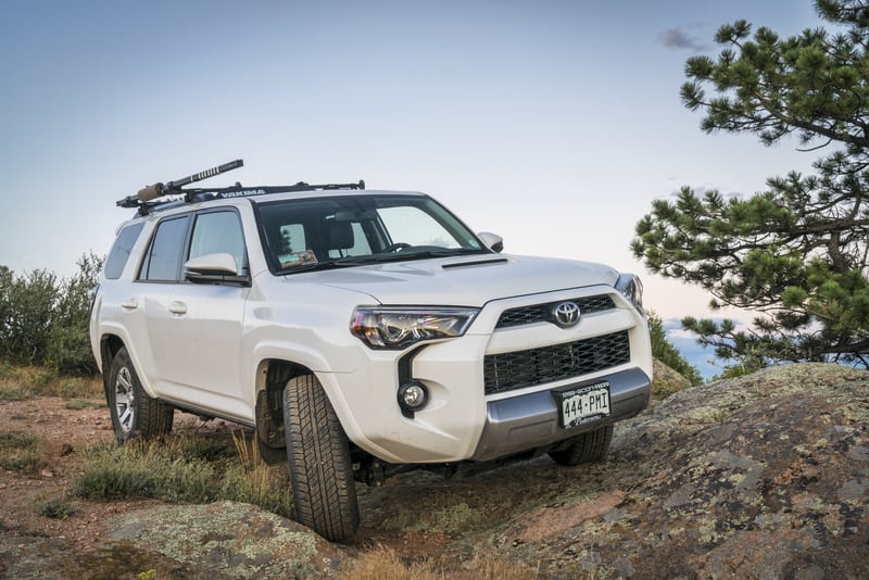 Motor Hills | 4Runner Vs Highlander Off Road: Which Is Better? White Toyota 4Runner 2016 parked on a rocky trail off-road
