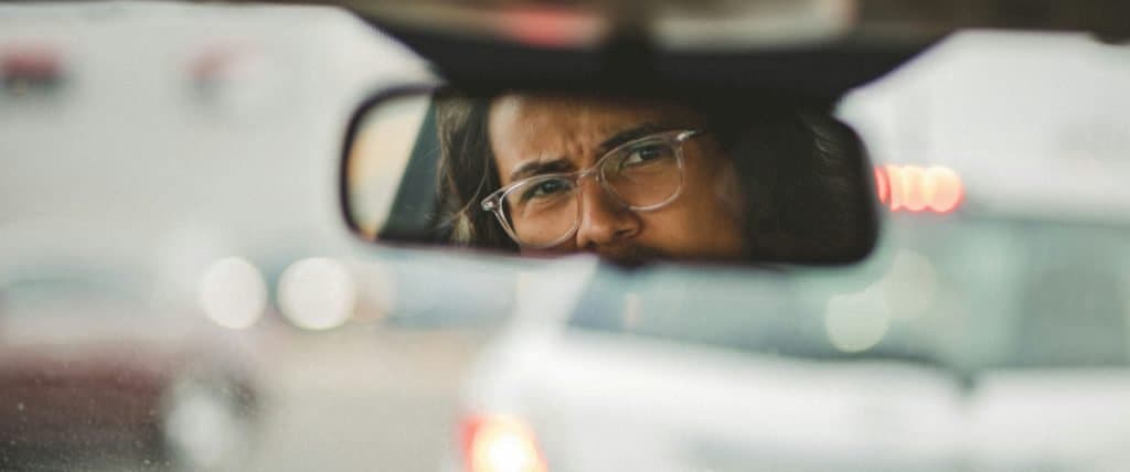 Motor Hills | The Dangers Of Getting Angry On The Road Man looking in the rearview mirror