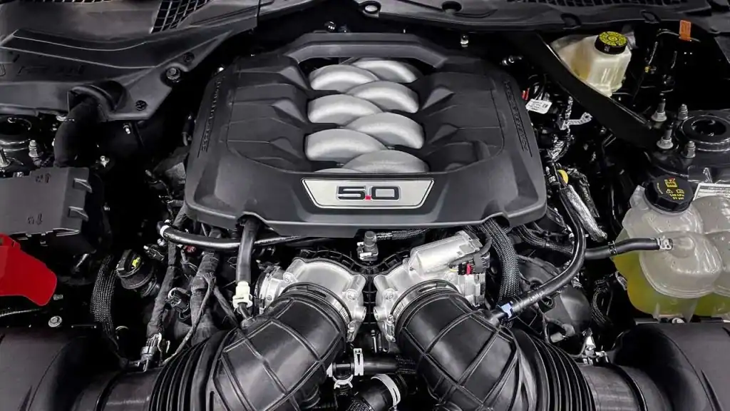 Motor Hills | Mustang or Camaro? Open hood ford mustang 5.0 liter engine
