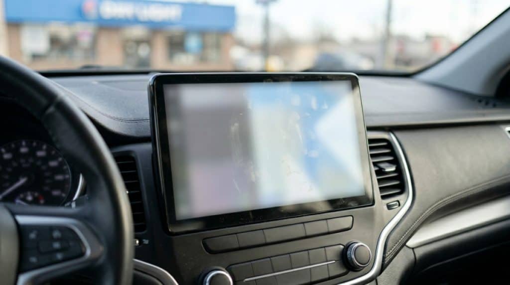 Motor Hills | How Much Driving Data Does Your Car Really Share in 2026? Privacy settings menu on a car screen shown as a blurred interface to represent brand differences