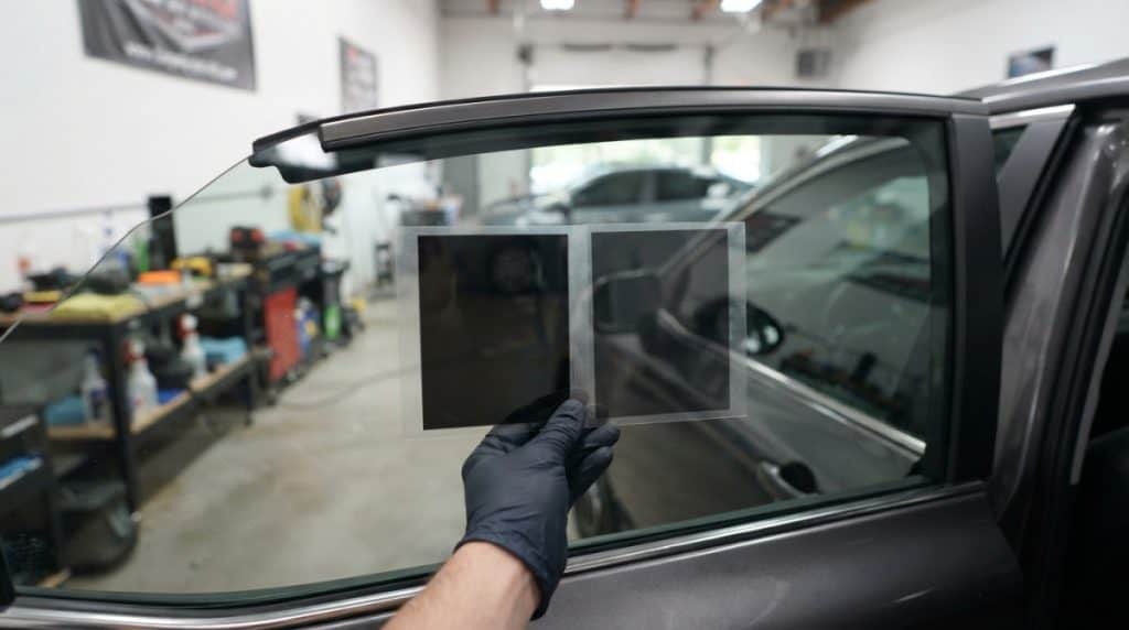 Motor Hills | Windshield Sunshade vs. Window Tint: Which Keeps Your Car Cooler? Comparison of dark and light automotive window tint film samples